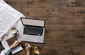 Aerial view of computer laptop on wooden table